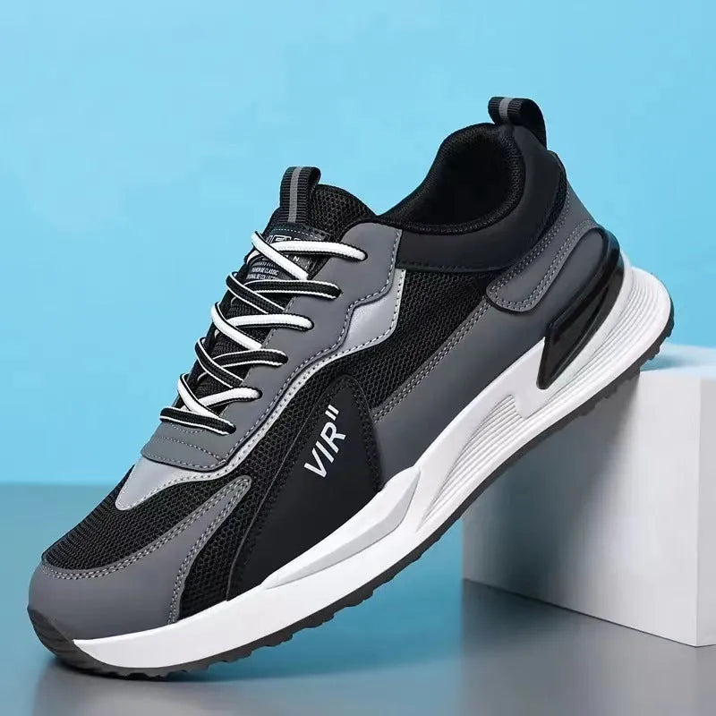 Men's colour block mesh lace-up sneakers in black, grey, and white on a injection moulded sole.
