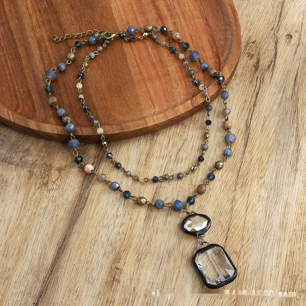 Adjustable tribal necklace with glass and stone pendant on two-layer chain in beige colour