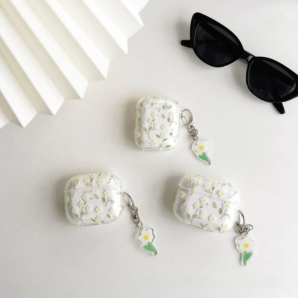 Transparent white floral TPU protective cover for Apple AirPods showing charging port access