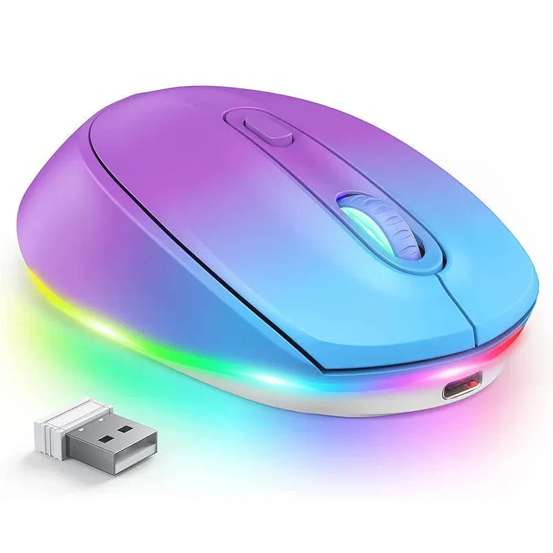 Compact 24g wireless ergonomic mouse with USB charging cable on a desk next to a laptop.