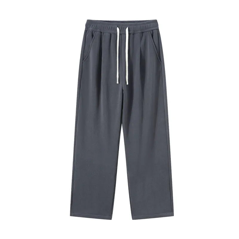 Man wearing apricot double-sided polar fleece lined loose fit casual sports trousers.