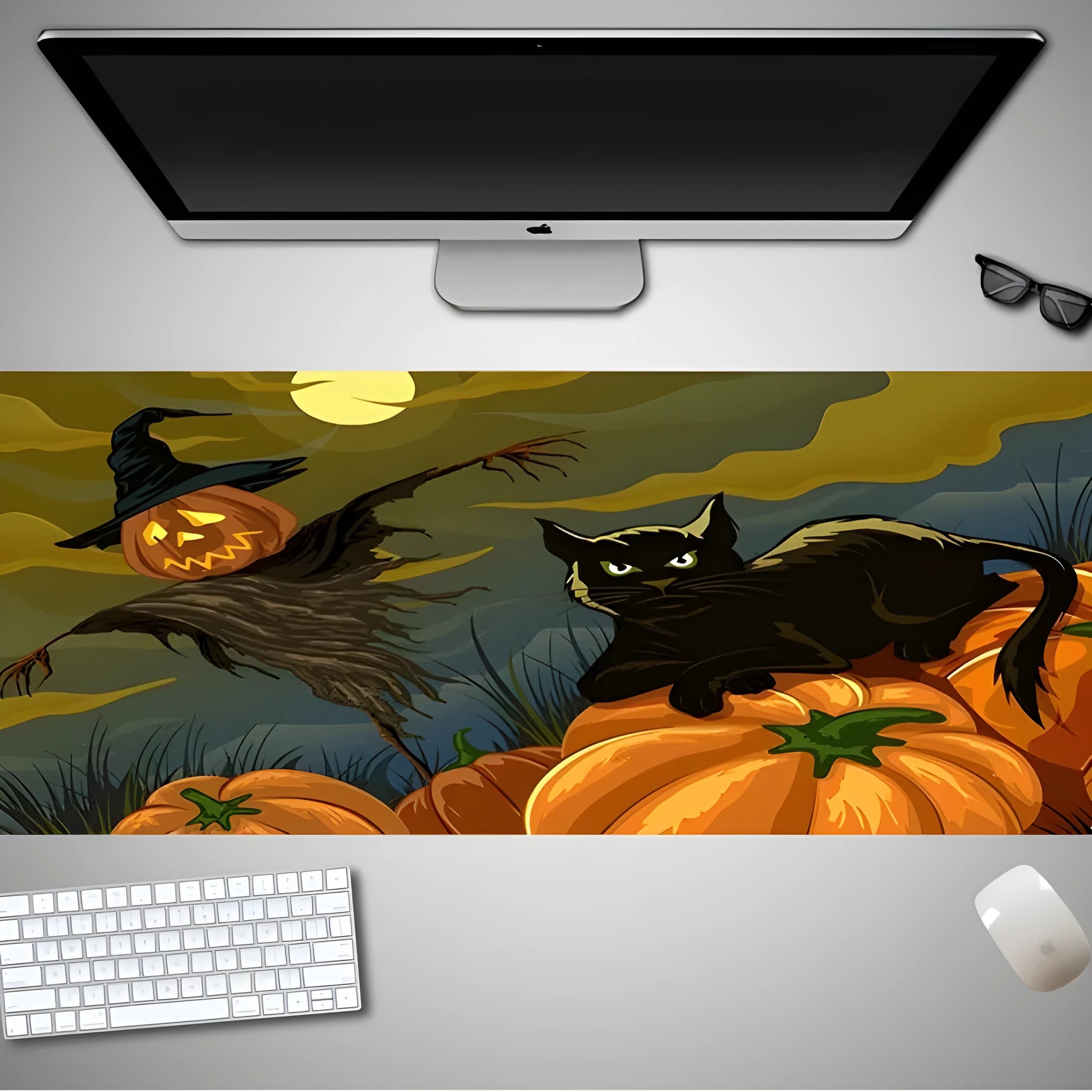 Oversized Halloween-themed gaming mouse pad on a desk, showing anti-slip base and graphic design.