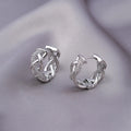Pair of micro zircon-encrusted woven twisted stud earrings in gold real gold plating finish