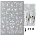 Pack of black and silver love pattern nail art strip stickers on a plastic sheet.
