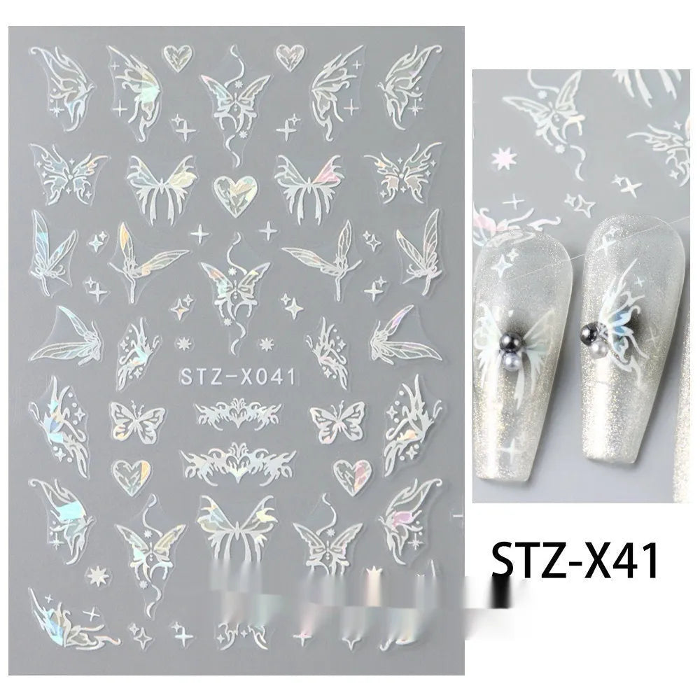 Pack of black and silver love pattern nail art strip stickers on a plastic sheet.