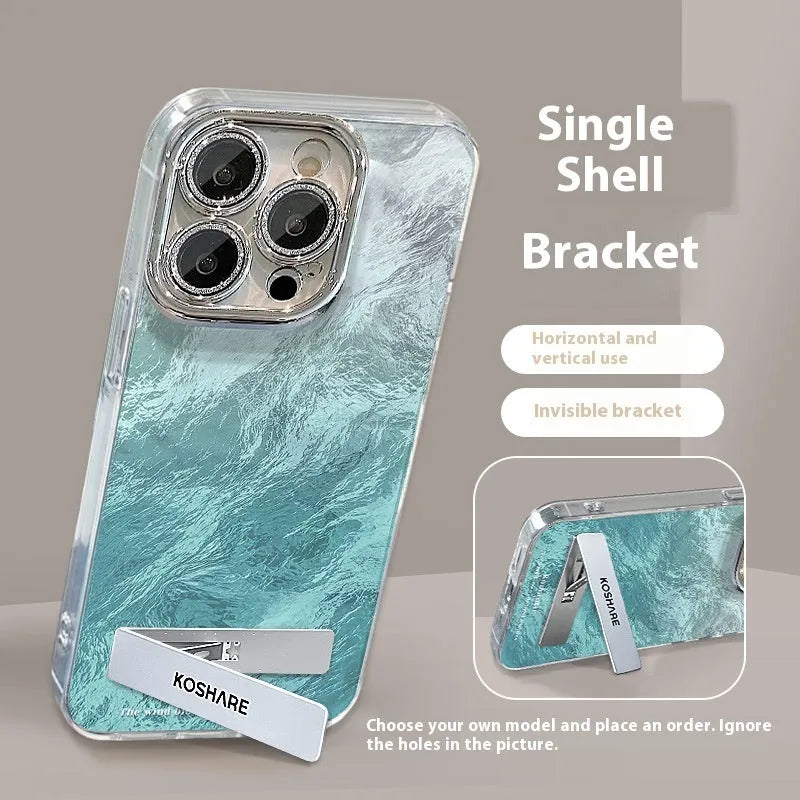 Ice blue gradient hard PC phone case with invisible bracket and silver chain for iPhone set on a white surface