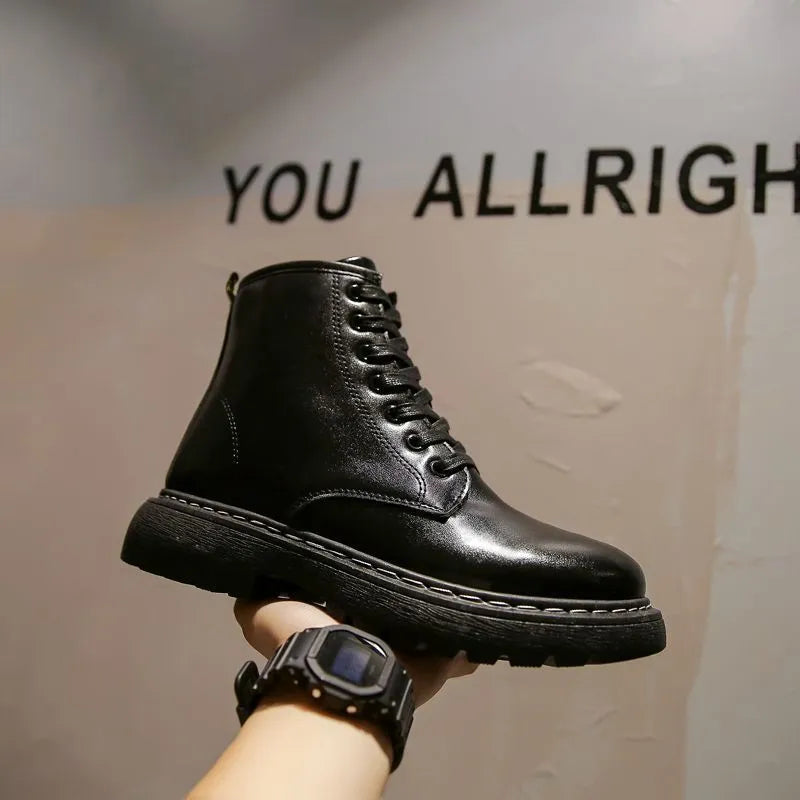 Black Dr. Martens men's platform ankle boots with side zip and fly weave pattern on frosted leather.