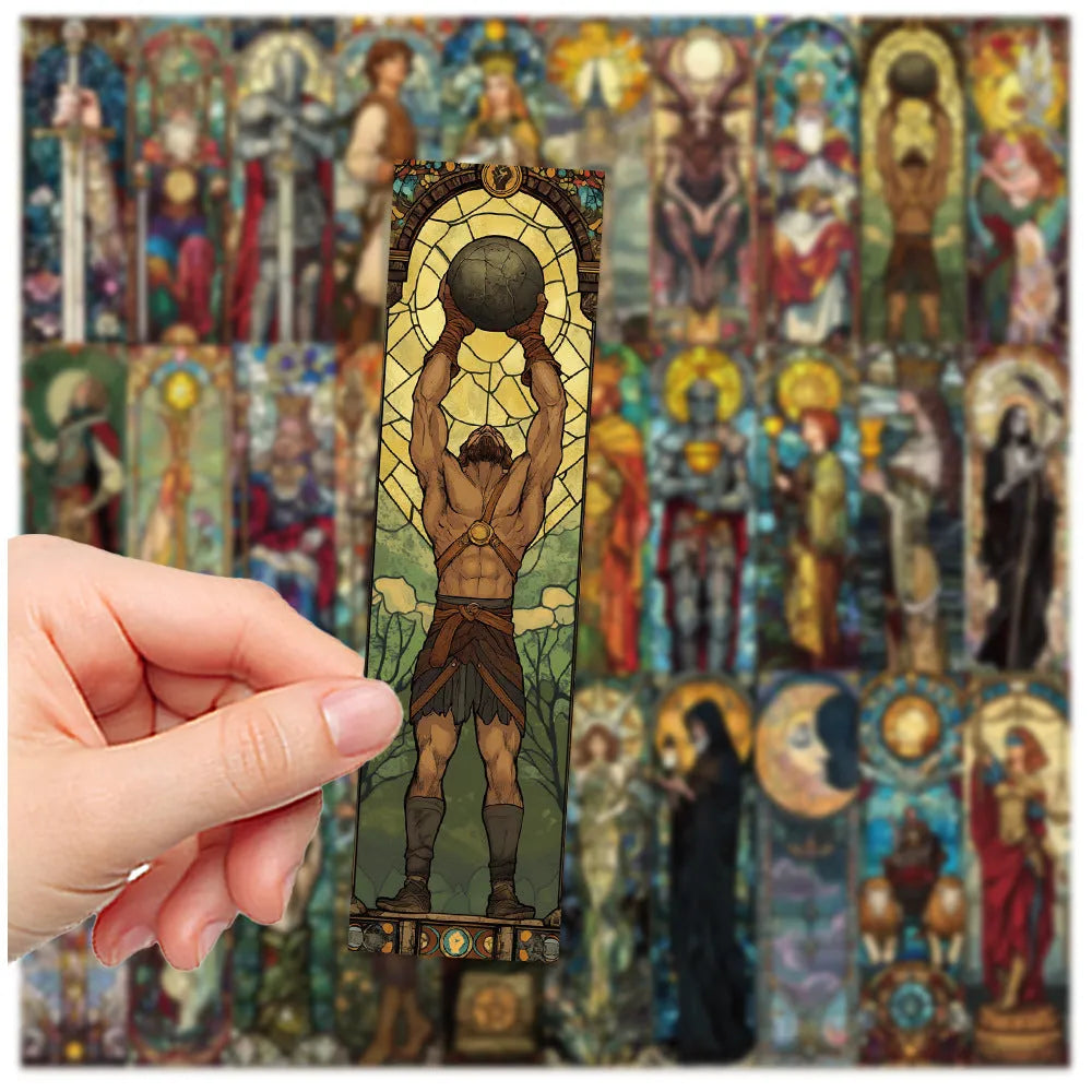 Set of 30 handmade paper tarot bookmarks with painted glass card designs.
