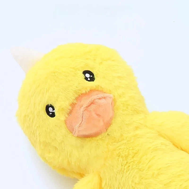 Pink and yellow golden retriever plush dog toy with squeaker and rattle.
