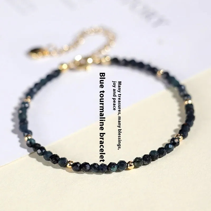 Blue tourmaline bracelet with 3mm cut beads and spacer bead design for women