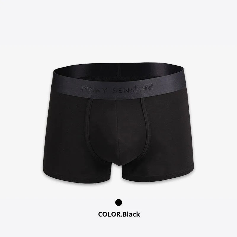 Men's solid colour cotton boxer shorts in black, white, grey, and light green.