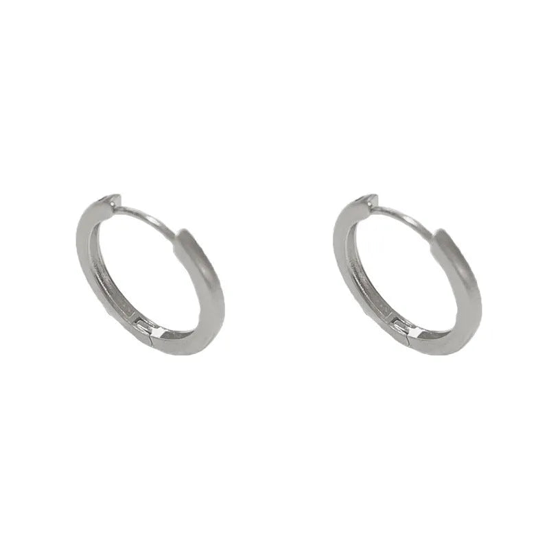 A pair of round geometric clip-on earrings for women in gold or silver plating.