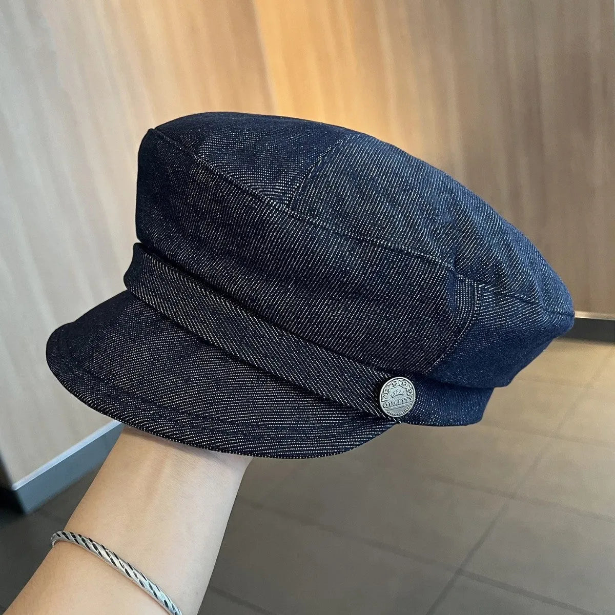 Dark blue denim octagonal newsboy hat with adjustable sizing for 54-58cm head circumference