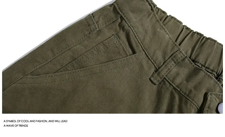 Women's apricot workwear-style cropped pants with wide legs and pocket rivets.
