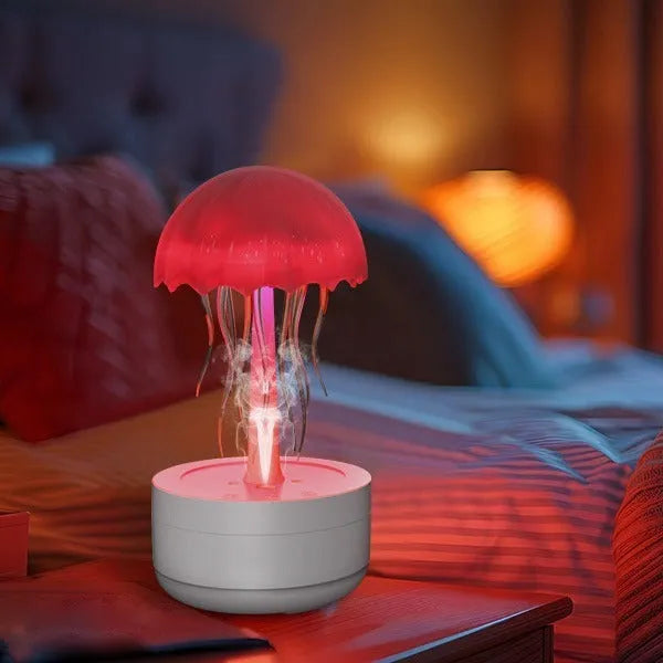 White jellyfish-shaped humidifier and essential oil diffuser with coloured LED lights and mist output.