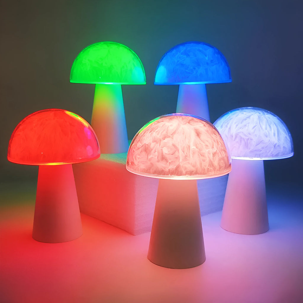 Small white mushroom-shaped night light with remote control on a wooden table.