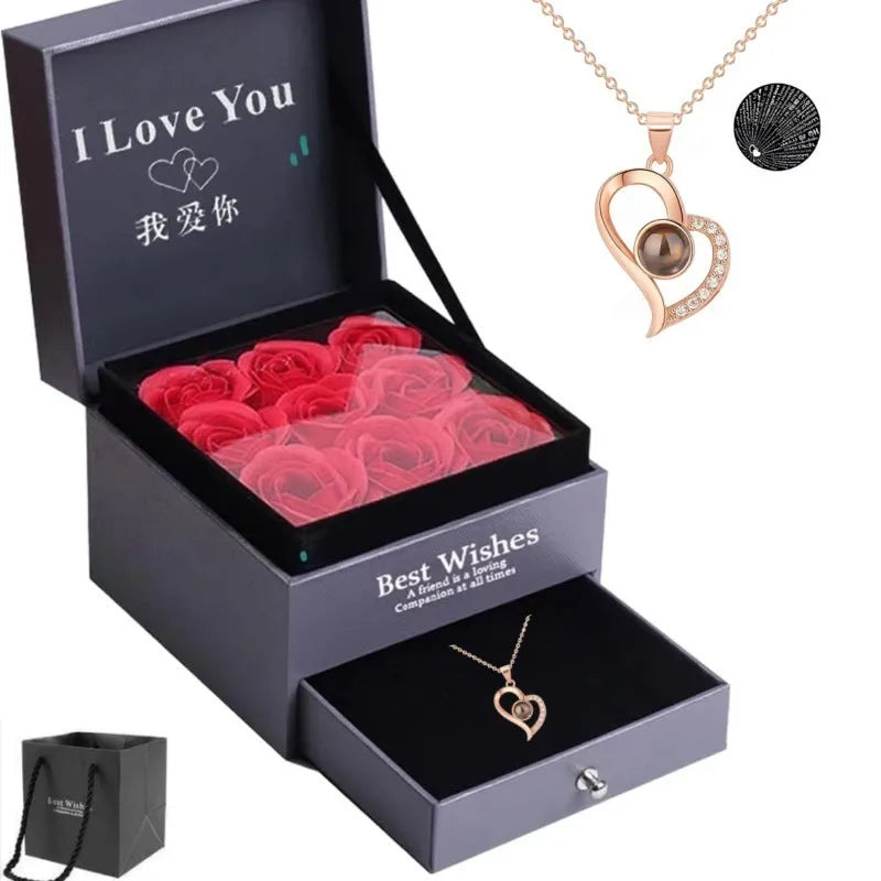 Rose gold heart-shaped projection necklace in copper with O chain, displaying 100 languages love message.