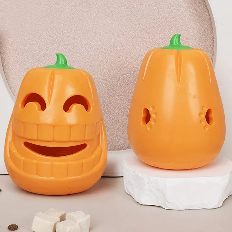 Red and orange Halloween pumpkin shaped interactive dog chew toy on a white background.