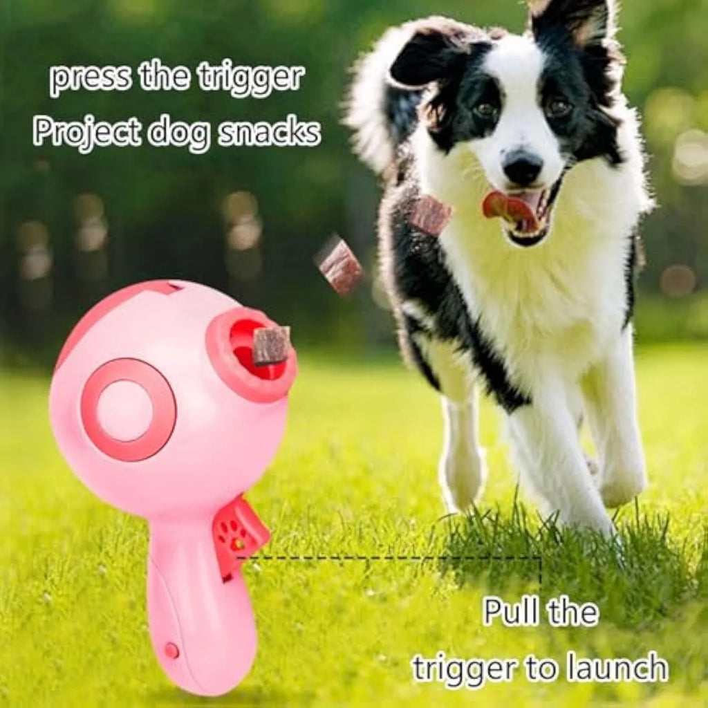 Green, orange, and pink dog treat launcher toy measuring 15.5 cm by 9 cm by 8.5 cm for remote feeding and training
