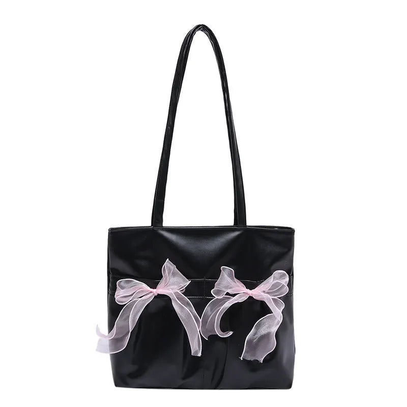 Black college-style tote bag with large capacity, a bow detail, and two shoulder straps.