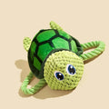 Grey turtle-shaped stuffed dog toy with internal knotted rope for chewing