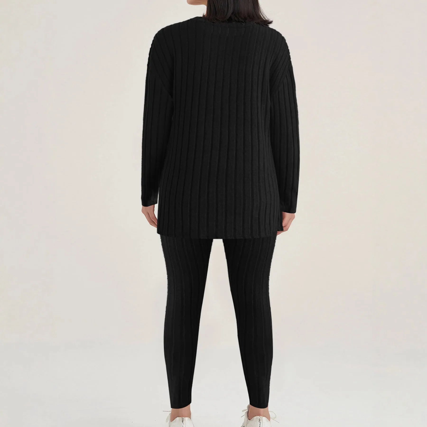 Black sunken stripe pattern two-piece loungewear set with regular sleeves on a hanger.