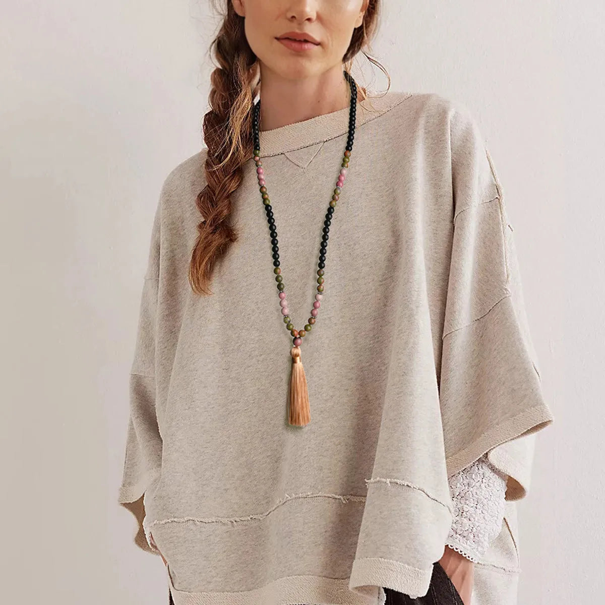 Long beaded bohemian necklace with 108 natural stones, a geometric pendant, and colourful tassels on an 81cm chain.