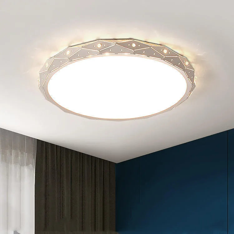 Round black iron frame LED ceiling light on a white ceiling.