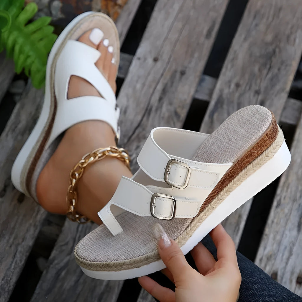 White patent leather wedge sandals with woven upper and finger fit design