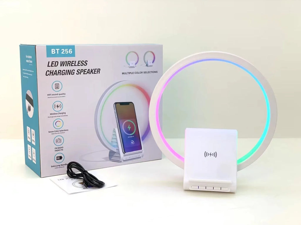 White smart Bluetooth speaker with wireless charging surface and LED ambience lighting