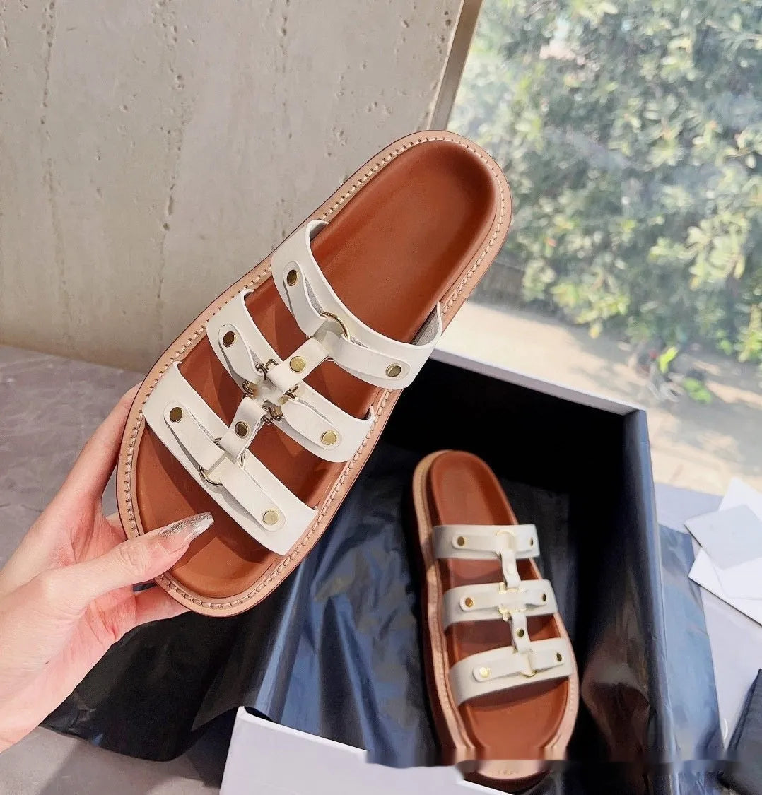 Women's Roman style sandal slippers in sheepskin with patent leather finish showing adjustable strap design