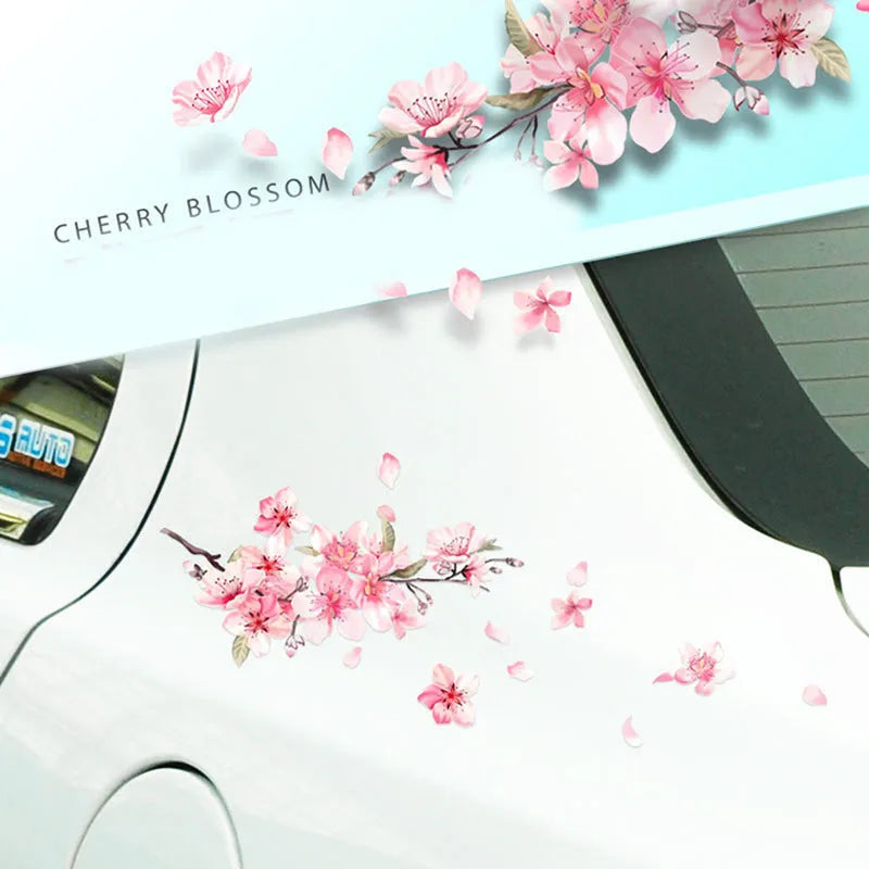 Close-up of a cherry blossom flower pattern on a PVC car sticker, shown with a peel-off backing.