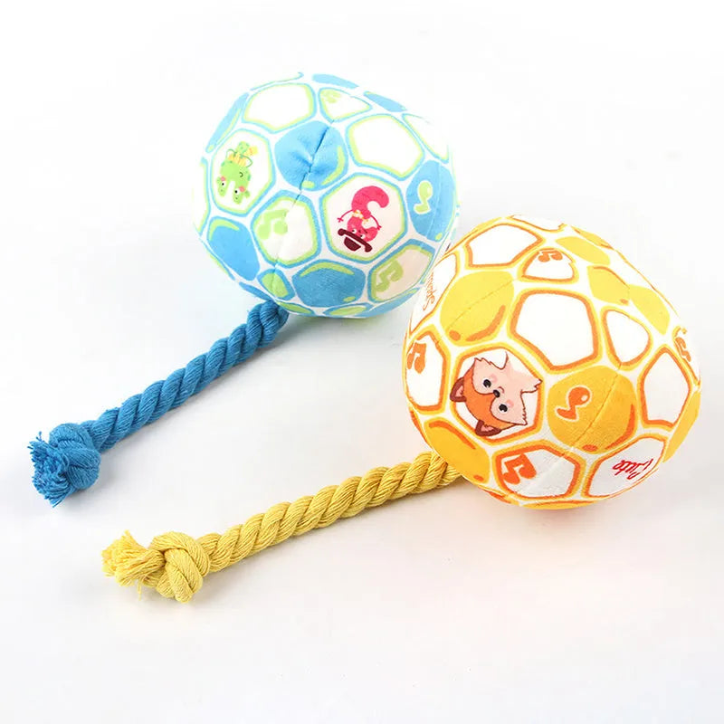 Blue and yellow elastic football dog toy with cotton rope for tug-of-war and chewing.