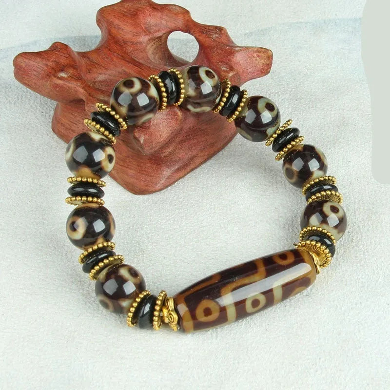 Distressed agate Tibet beads bracelet with three eye dzi design and polished stone beads