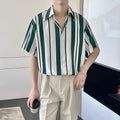 Loose casual colour-block top in green with pointed collar made from yarn-dyed fabric