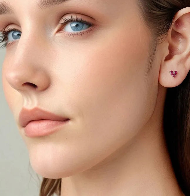 Rose red heart shaped 925 silver small ear studs for women on white background