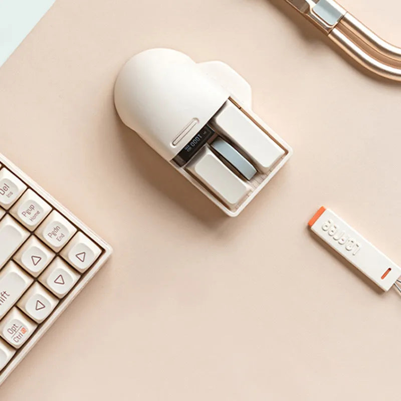 Tofu colour ergonomic wireless mouse shown with USB receiver and USB-C charging cable on a desk.