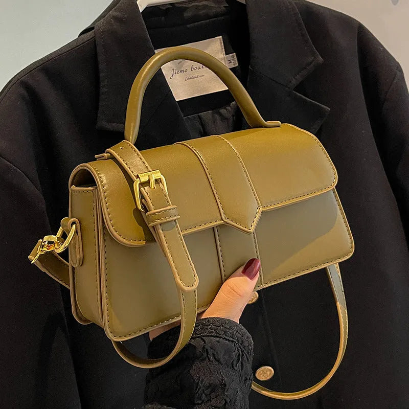 Women's beige PU messenger bag with sandwich pocket and file organiser interior.