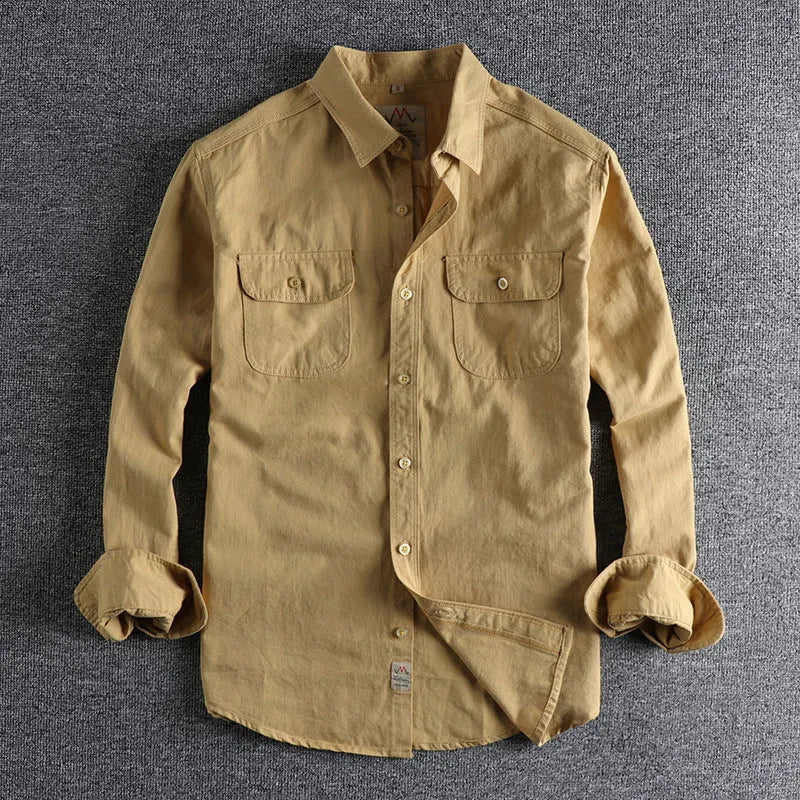 Men's light blue cotton long sleeve shirt in a retro cardigan style on a hanger