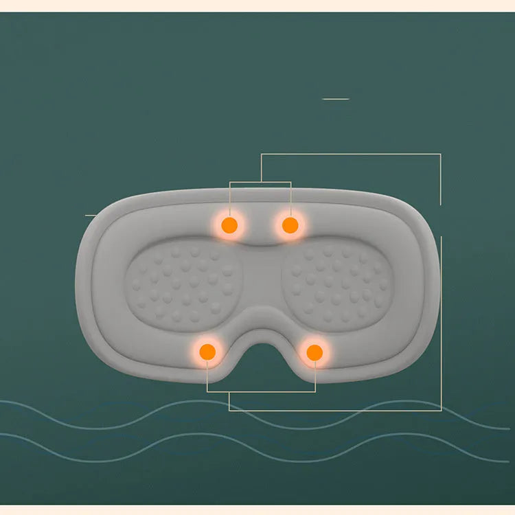 Pink portable eye spa massage goggles with USB cable on a grey background.