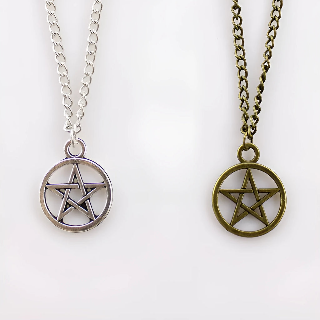 Vintage pentagram necklace on alloy adjustable chain, bronze finish, lying flat on grey surface
