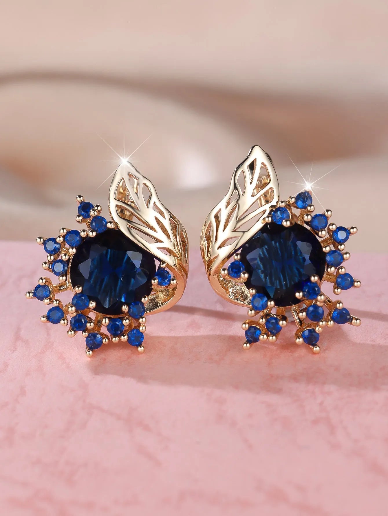 Round flower feather zircon drop earrings with champagne gold electroplate and coloured crystal settings.
