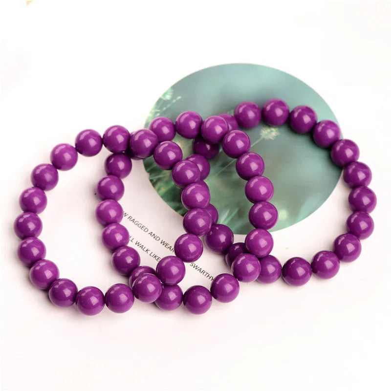 Jiuya polished purple mica crystal bracelet shown in three bead size variations on a wrist.