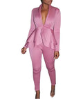 Business casual shirt and pencil pants set in polyester fabric on a hanger.