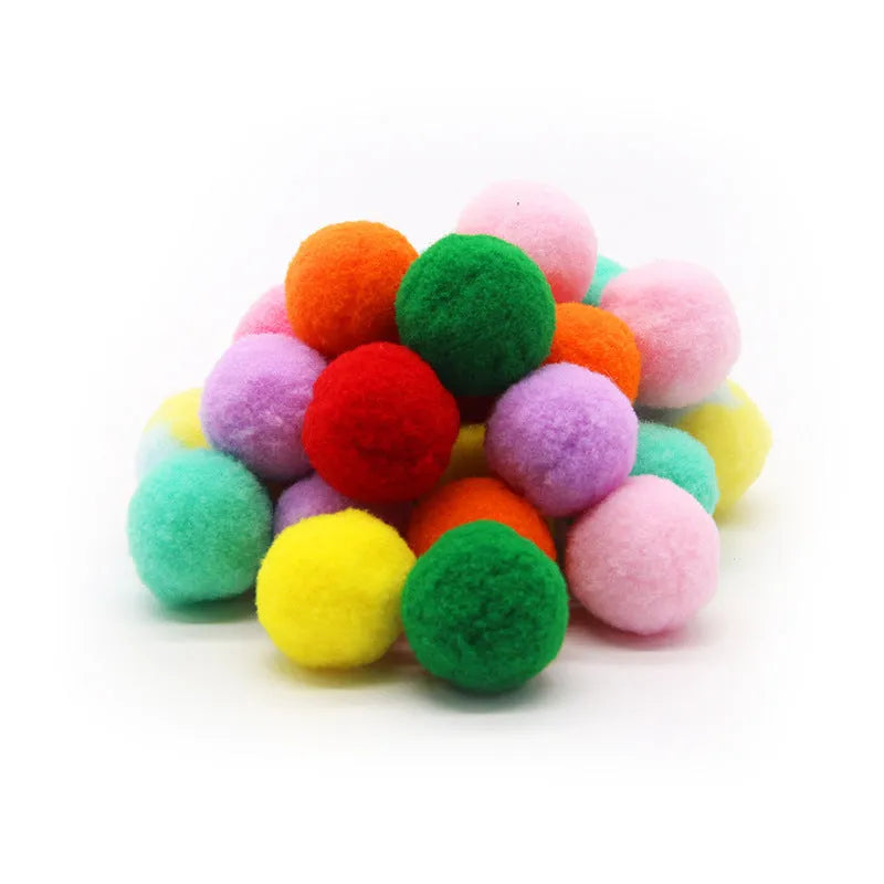 Pet toy launcher gun with soft plush balls for fetch games.