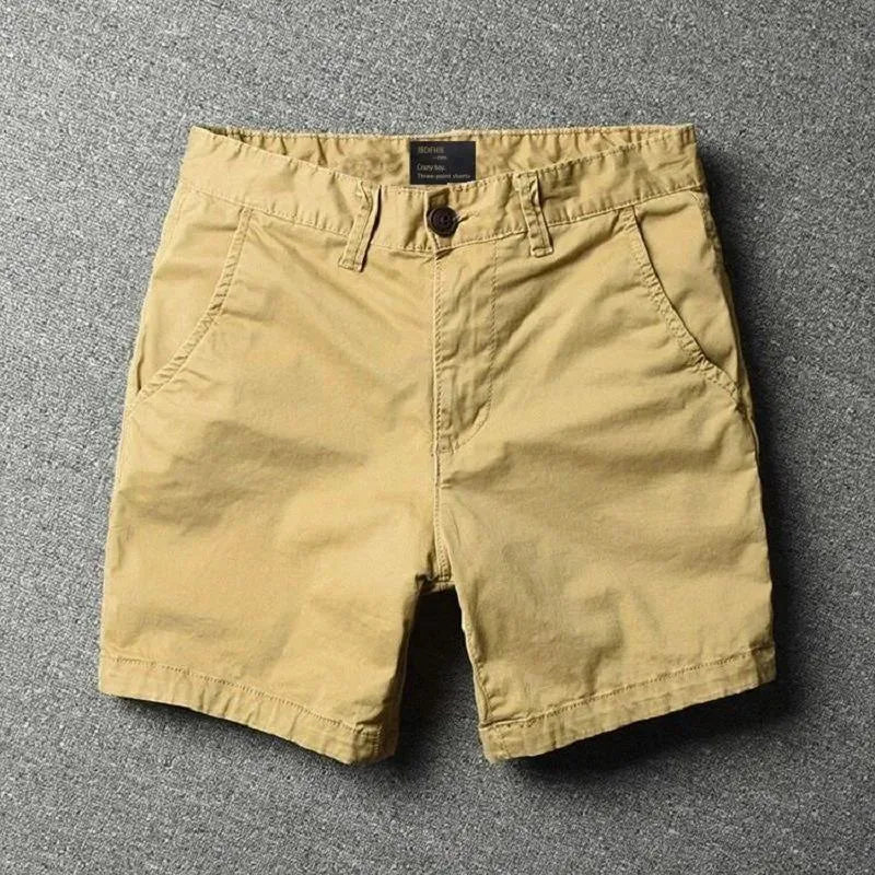 Men's straight-leg cotton casual shorts in a loose fit, shown in a solid colour with a zipper fly.