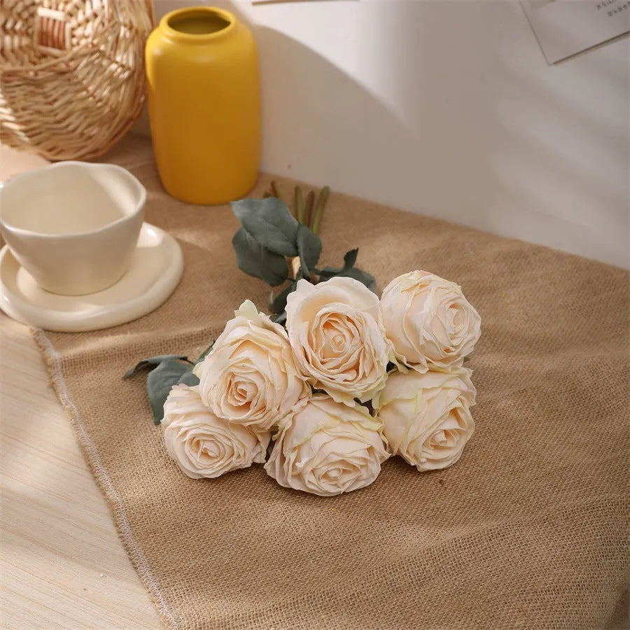 Single burnt edge simulated silk rose artificial flower with 38cm stem on neutral background