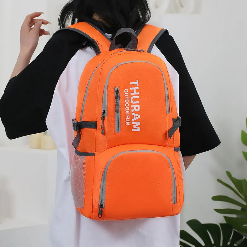 Portable folding shoulder bag 20-35L in dark blue for outdoor hiking