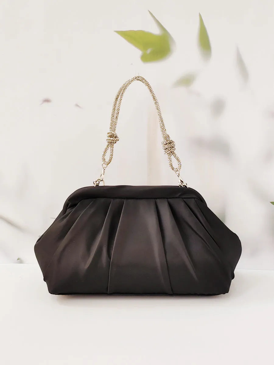 Women's soft polyester shell-shaped messenger bag in lavender purple with folds, diamond patterns, and a chain detail.