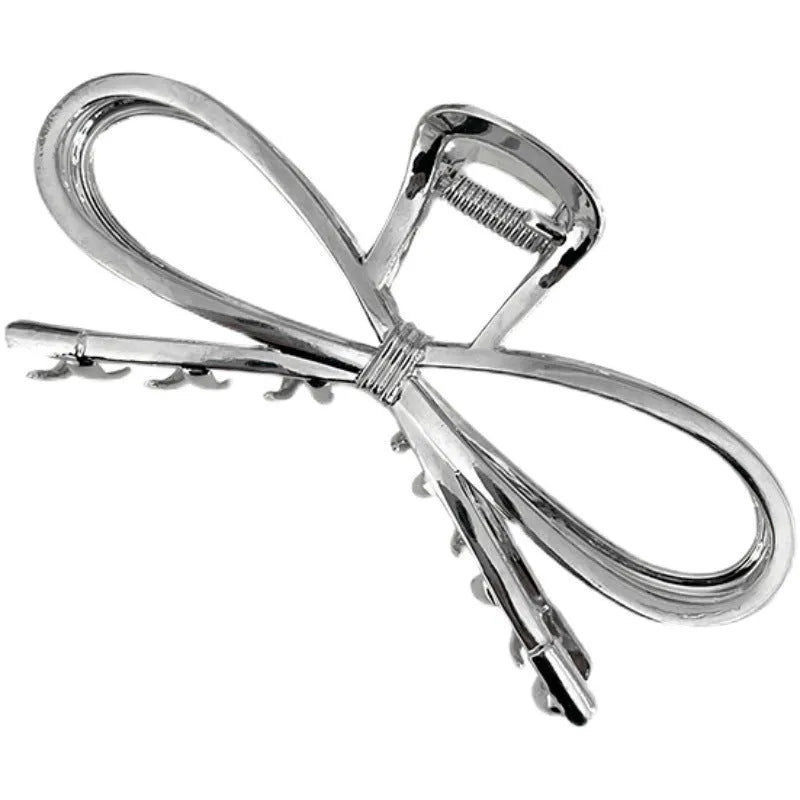 Women's alloy bow barrette hair clip in gold or silver with back-head grip